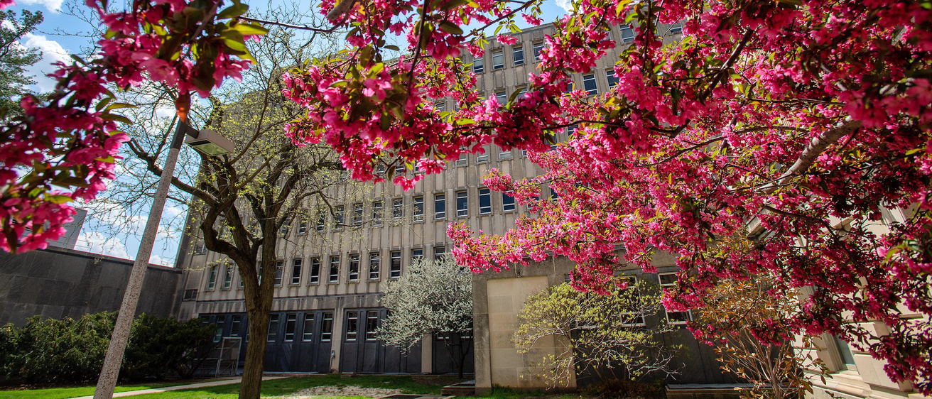 exterior of biology building in spring